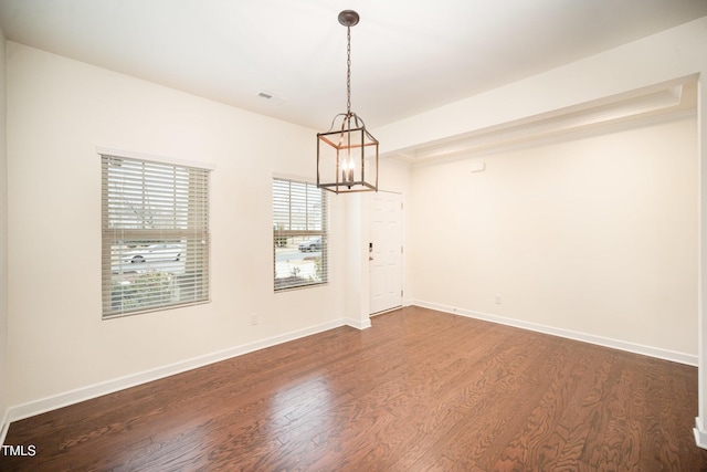 spare room featuring dark wood-type flooring