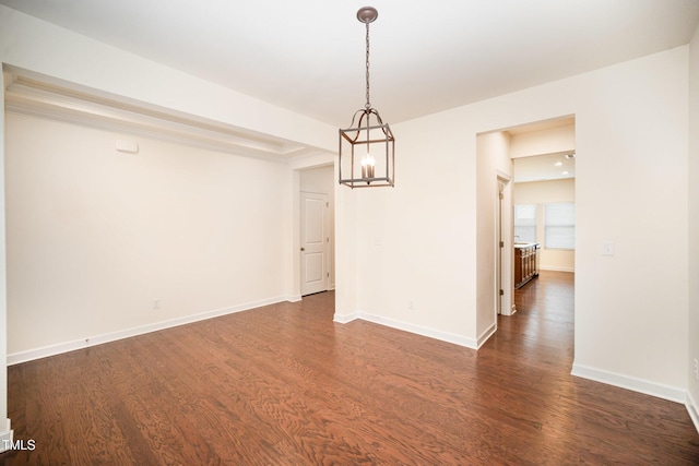 unfurnished dining area with dark hardwood / wood-style floors