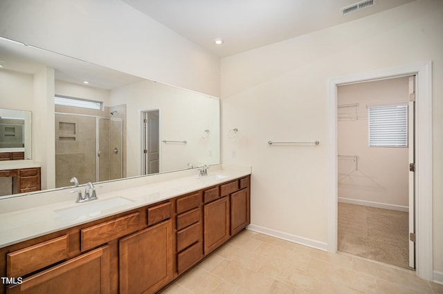 bathroom featuring walk in shower and vanity