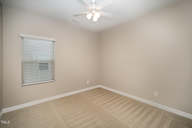 spare room with carpet flooring and ceiling fan