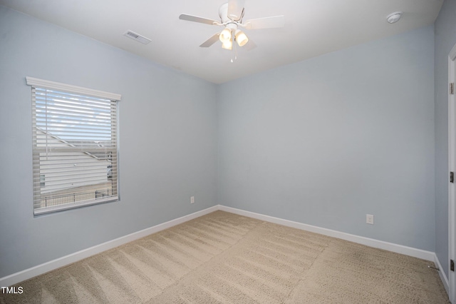 unfurnished room with carpet floors and ceiling fan