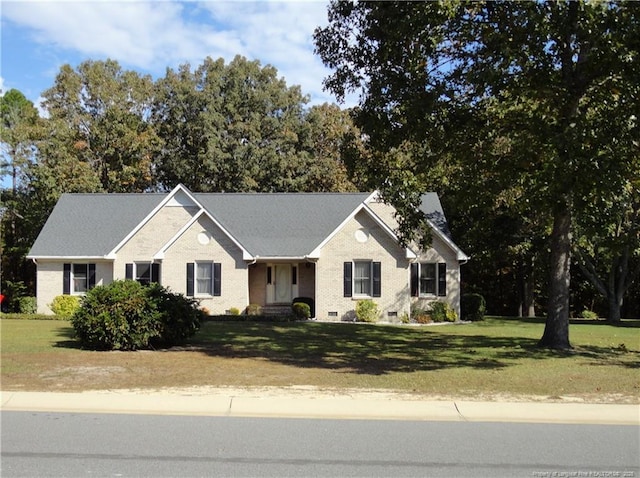 ranch-style home with a front yard