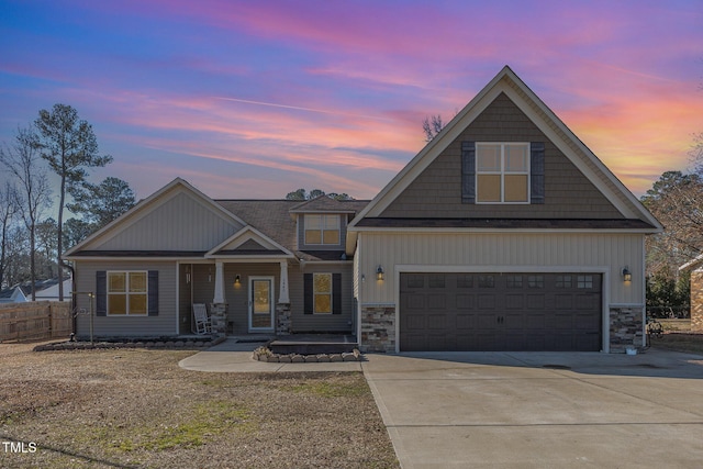 craftsman-style home featuring a porch and a garage