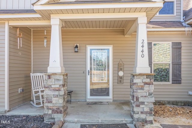 doorway to property with covered porch