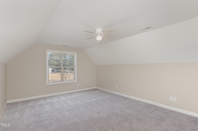 bonus room with light carpet, vaulted ceiling, and ceiling fan