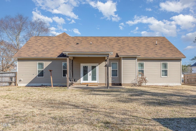 back of property featuring a patio, a lawn, and french doors