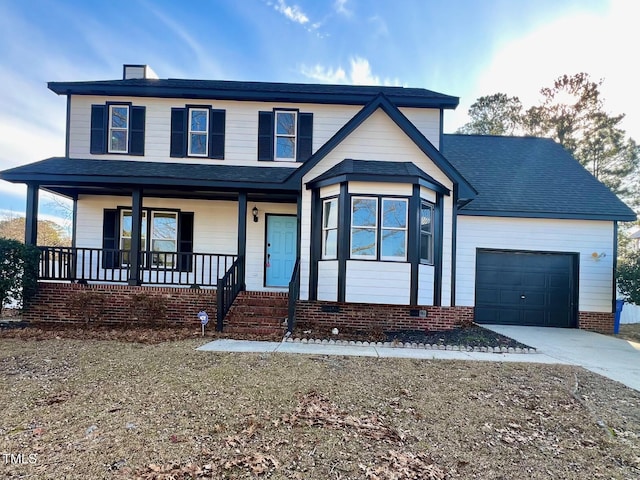 view of front of home featuring a porch and a garage