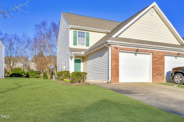 view of front of home with a garage and a front yard