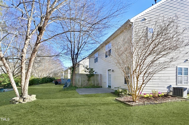 view of yard with a patio and central air condition unit