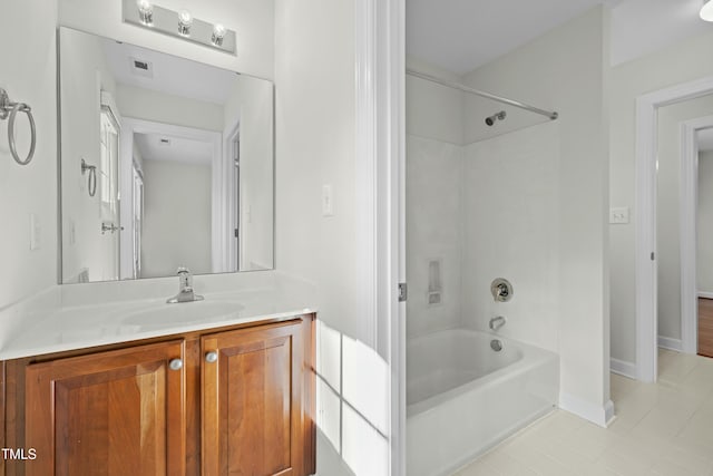 full bathroom with vanity, baseboards, visible vents, and shower / bathtub combination