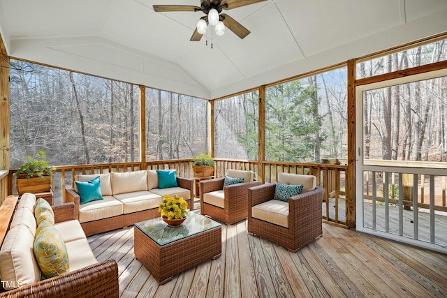 sunroom featuring a ceiling fan and lofted ceiling