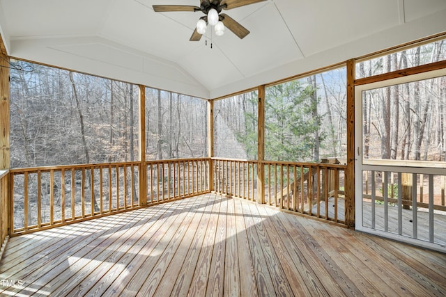 unfurnished sunroom with vaulted ceiling and ceiling fan