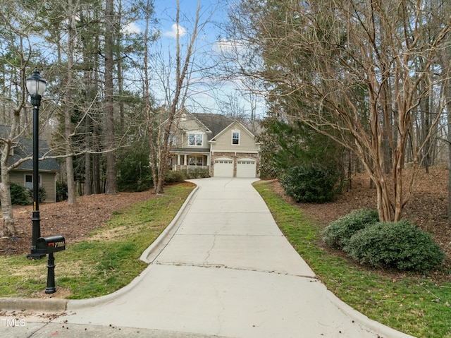 traditional home with stone siding and driveway