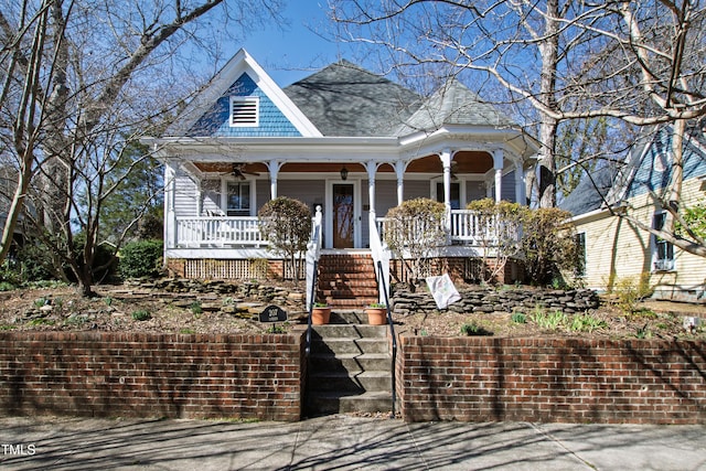 view of front of house with covered porch and stairway