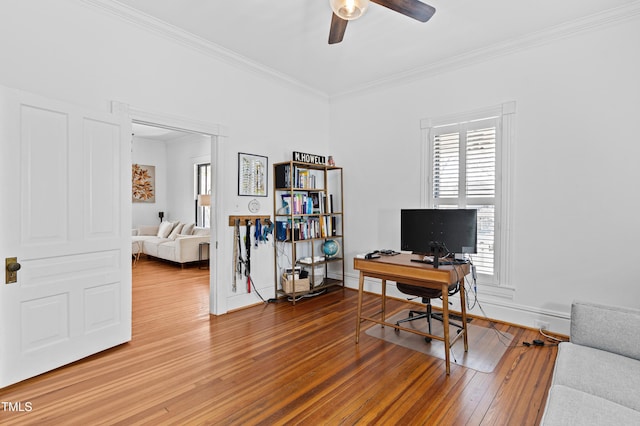 office area featuring a ceiling fan, baseboards, ornamental molding, and hardwood / wood-style floors