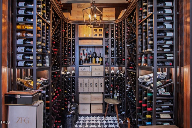 wine room with an inviting chandelier