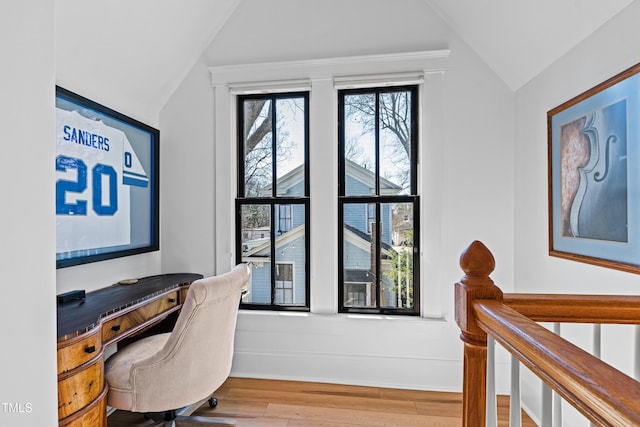 office with vaulted ceiling and wood finished floors