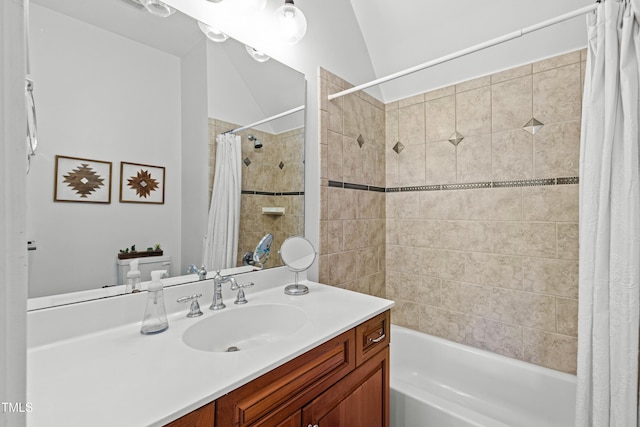 bathroom featuring lofted ceiling, vanity, and shower / bathtub combination with curtain