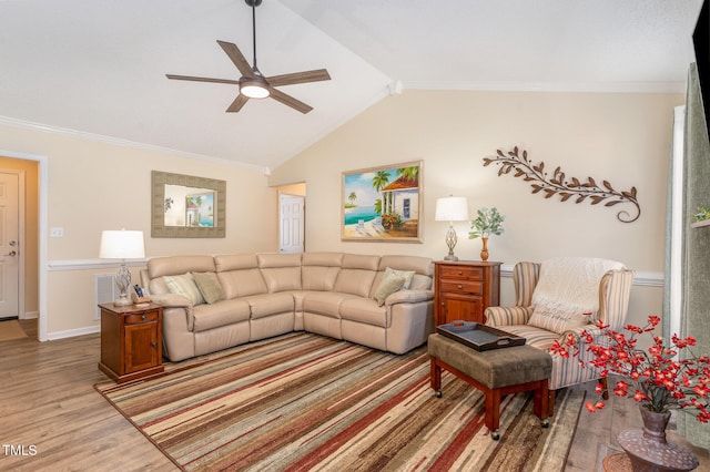 living room with vaulted ceiling, ornamental molding, ceiling fan, and light wood-type flooring