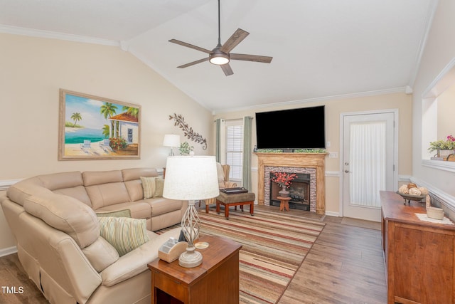 living room featuring crown molding, ceiling fan, lofted ceiling, and hardwood / wood-style floors