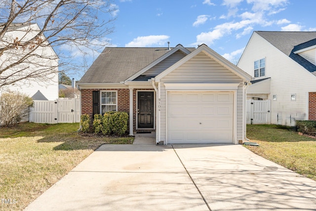 view of front facade with a garage and a front lawn