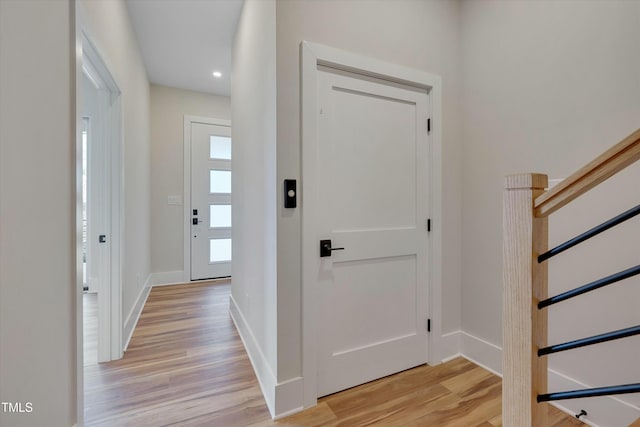 entryway featuring a wealth of natural light and light hardwood / wood-style floors