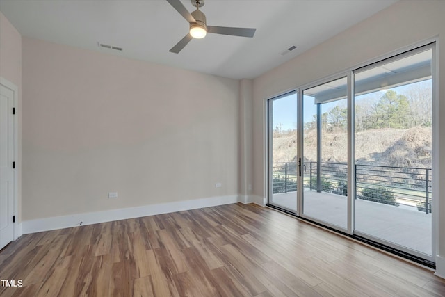 unfurnished room featuring ceiling fan and light hardwood / wood-style flooring