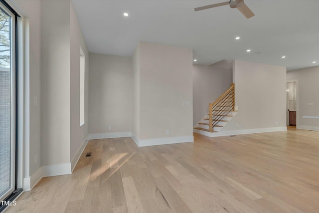 unfurnished room featuring ceiling fan and light hardwood / wood-style flooring