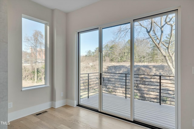 doorway to outside featuring light hardwood / wood-style floors