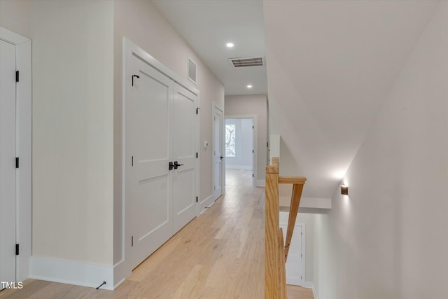 corridor with light hardwood / wood-style flooring