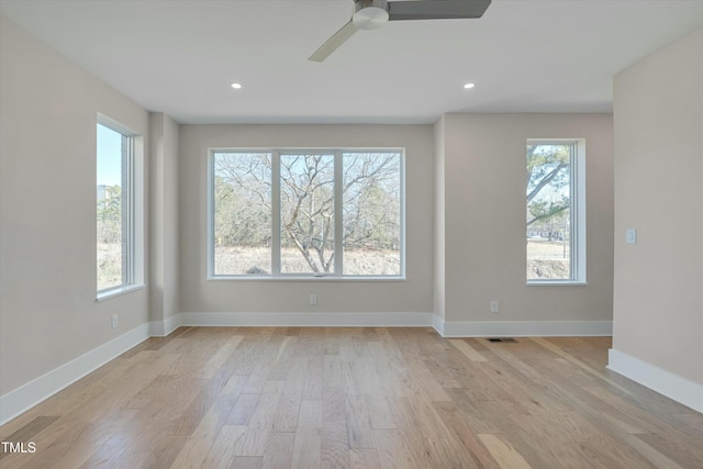 spare room with ceiling fan and light hardwood / wood-style floors