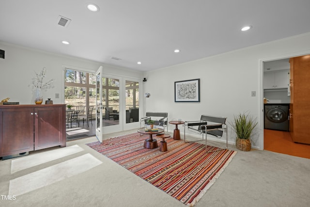 living room featuring washer / clothes dryer, recessed lighting, and ornamental molding