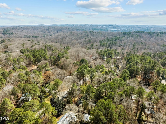 drone / aerial view featuring a forest view