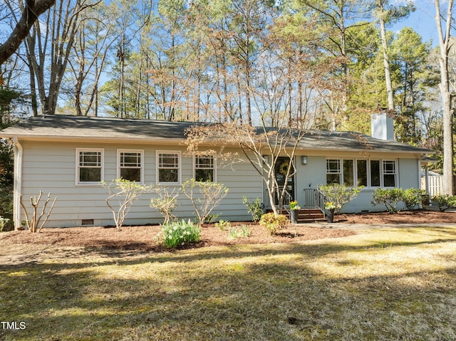 single story home featuring crawl space, a chimney, and a front yard