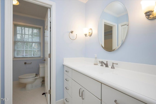 bathroom featuring crown molding, vanity, tile patterned floors, and toilet