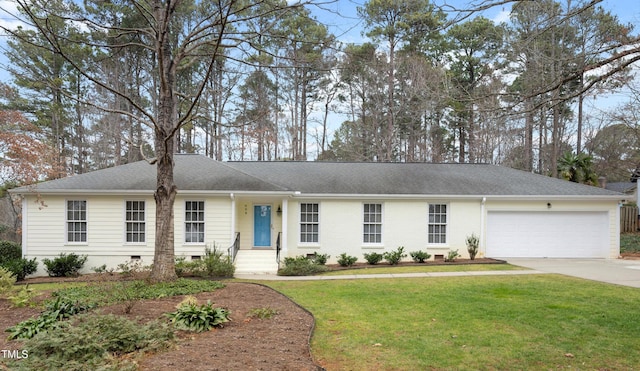 ranch-style home with a garage and a front lawn