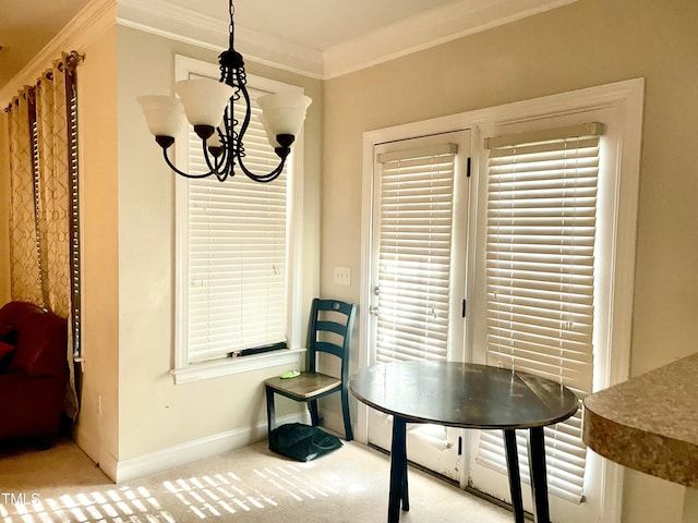 dining room featuring a notable chandelier, ornamental molding, and carpet