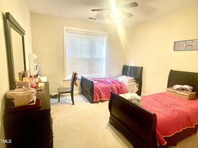 bedroom with light carpet and ceiling fan