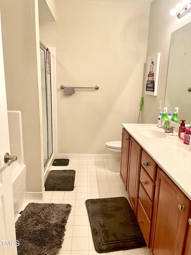 full bathroom with shower with separate bathtub, toilet, tile patterned floors, and vanity