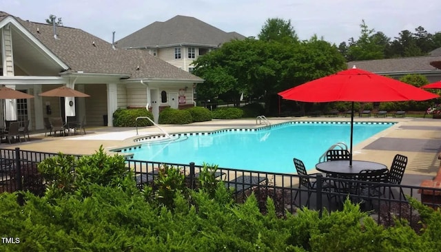 view of pool featuring a patio area