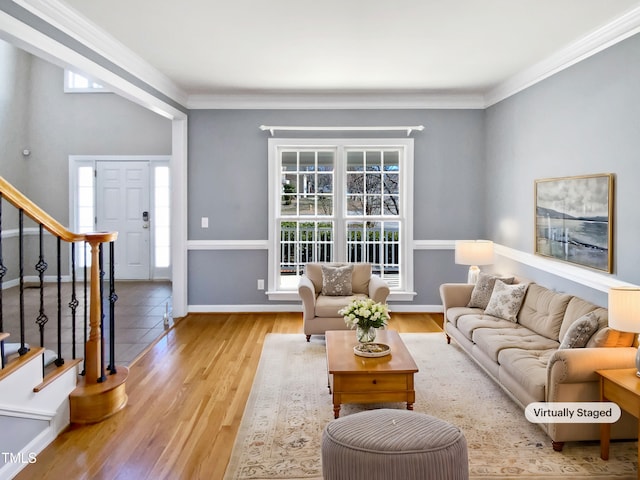 living room featuring crown molding and light hardwood / wood-style floors