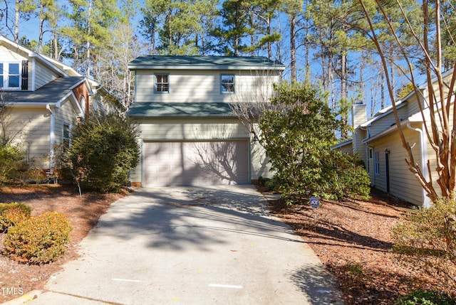 front of property with a garage