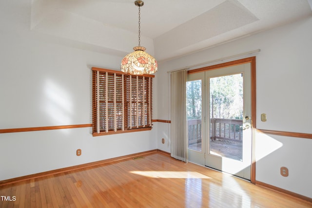 unfurnished dining area with hardwood / wood-style flooring