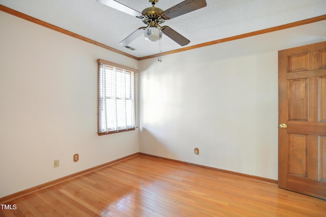 empty room with ceiling fan, crown molding, light hardwood / wood-style flooring, and a textured ceiling