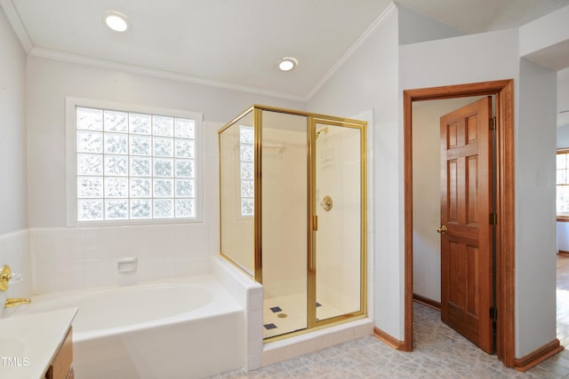 bathroom with vanity, crown molding, and plus walk in shower