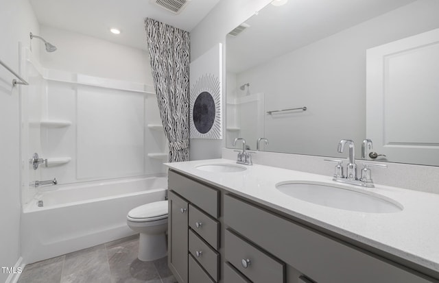 full bathroom with vanity, toilet, and washtub / shower combination