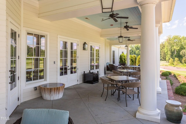 view of patio with french doors and ceiling fan