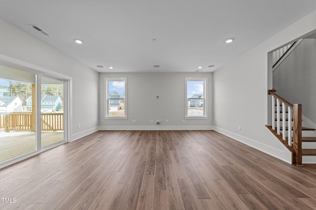 unfurnished living room featuring wood-type flooring