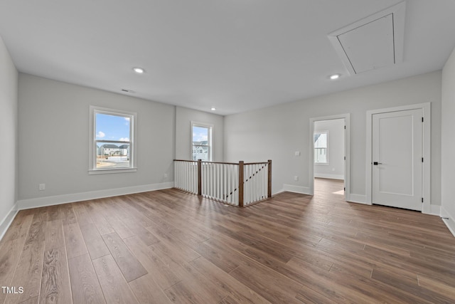 unfurnished room featuring hardwood / wood-style floors