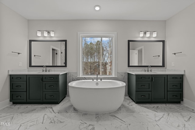 bathroom featuring vanity and a bathing tub